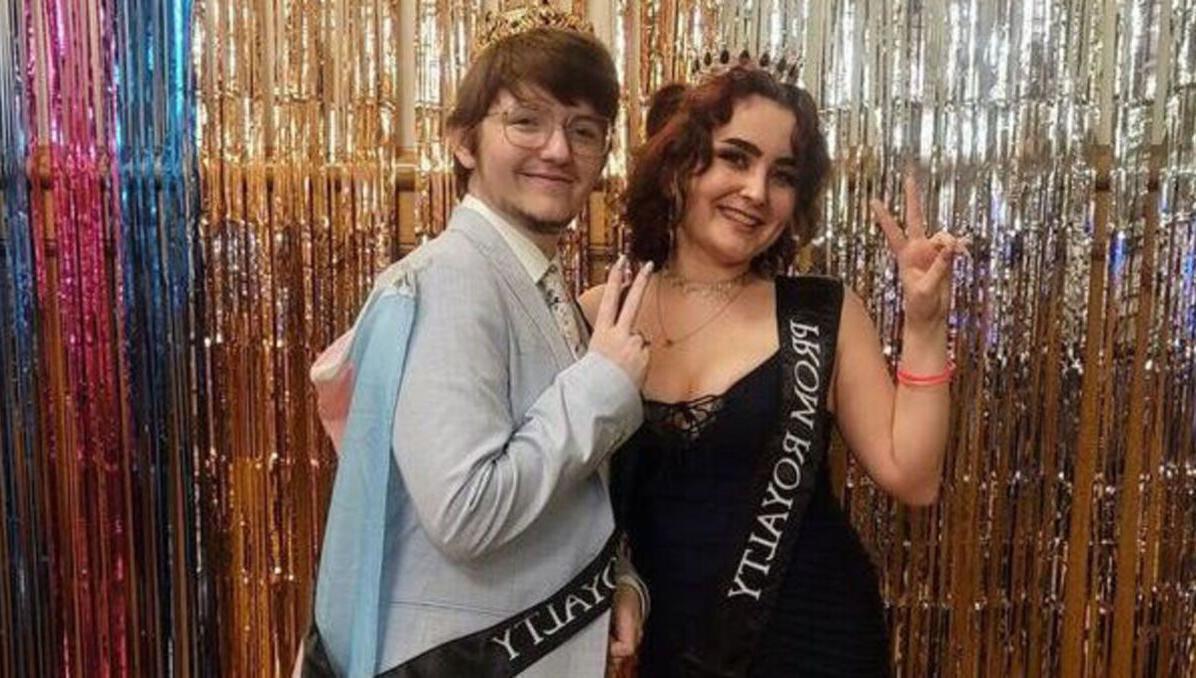 Two Pride Prom royalty members pose for a picture
